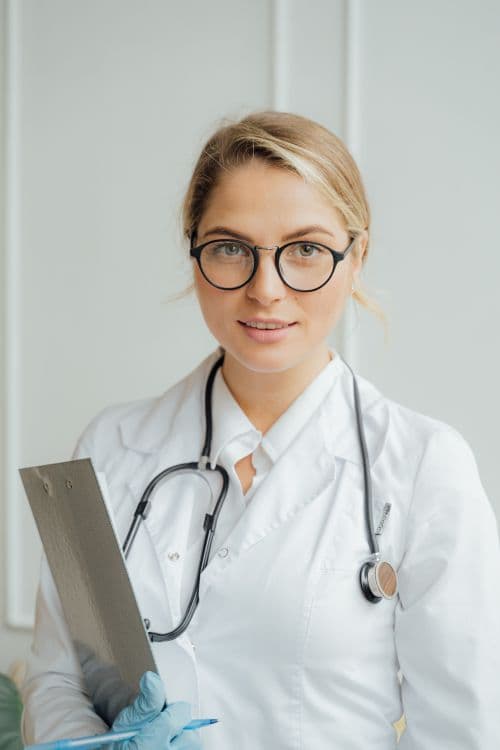 A healthcare professional holding a clipboard